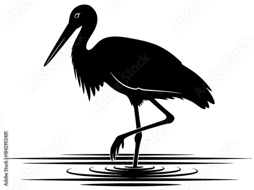 Elegant Black Silhouette of a Stork Standing in Water with Ripples