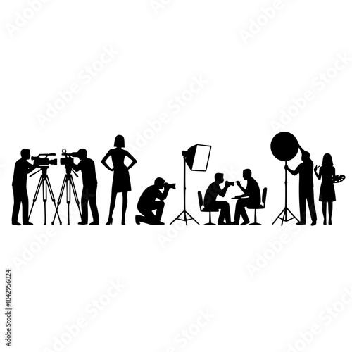 Silhouetted Film Crew on Set with Cameras and Lighting: Man and Woman Operators