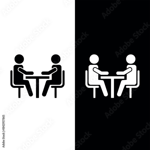 Minimalist icons depicting two people sitting at a table engaging in conversation or working together suitable for business or social themes