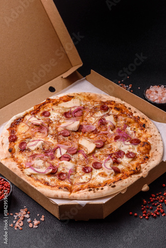 Schilderij op canvas Italian pizza with sausage, chicken, and cheese for dinner