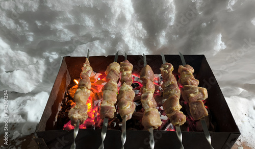 shashlik is grilled on the grill in winter