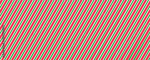 Repeating diagonal stripe pattern in traditional Christmas colors of red, green and white, festive wrapping paper design, ideal for seasonal backgrounds and fabric prints
