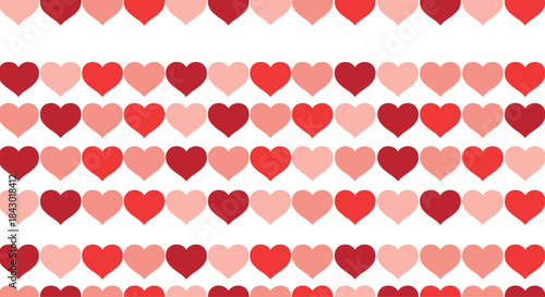 Rows of red and pink heart shapes align in a repeating decorative pattern across a light background creating a romantic textile like design for valentines.