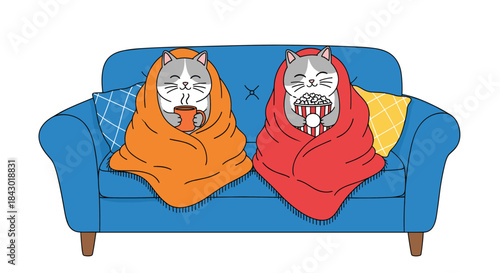 Two contented cats tucked in bright orange and red blankets lounge on a blue couch while sharing snacks and enjoying a cozy movie night together.