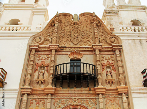 Close-up of ornate balcony and entrance to San Xavier Del Bac Mission on the Tohono Oodham reservation in the village of Wark, near Tucson, Arizona, USA.