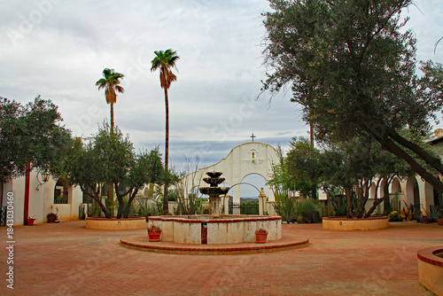Garden and fountain outside San Xavier Del Bac Mission on the Tohono Oodham reservation in the village of Wark, near Tucson, Arizona, USA.