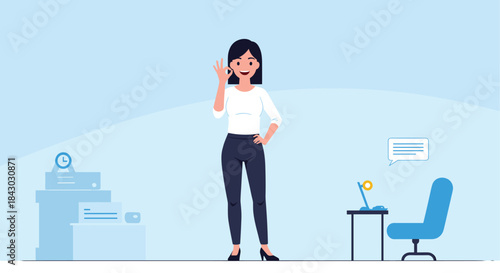 Confident female professional stands in a bright modern office and signals success with an ok gesture while surrounded by workspace furniture.