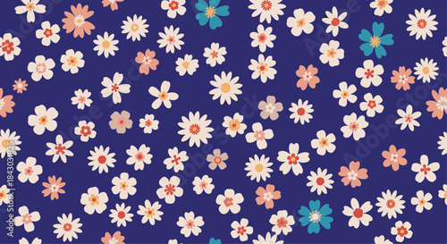 Bright tiny flowers in pink peach white and teal scatter across a deep blue background to create a lively seamless pattern perfect for textile design.