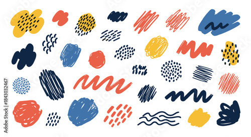 Colorful abstract doodle collage of varied brush strokes blobs dots and swirls in yellow red blue and navy on white creating a playful modern art composition.