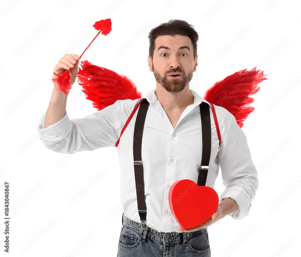 Obraz premium Surprised man dressed as Cupid with heart and arrow on white background. Valentine's Day celebration