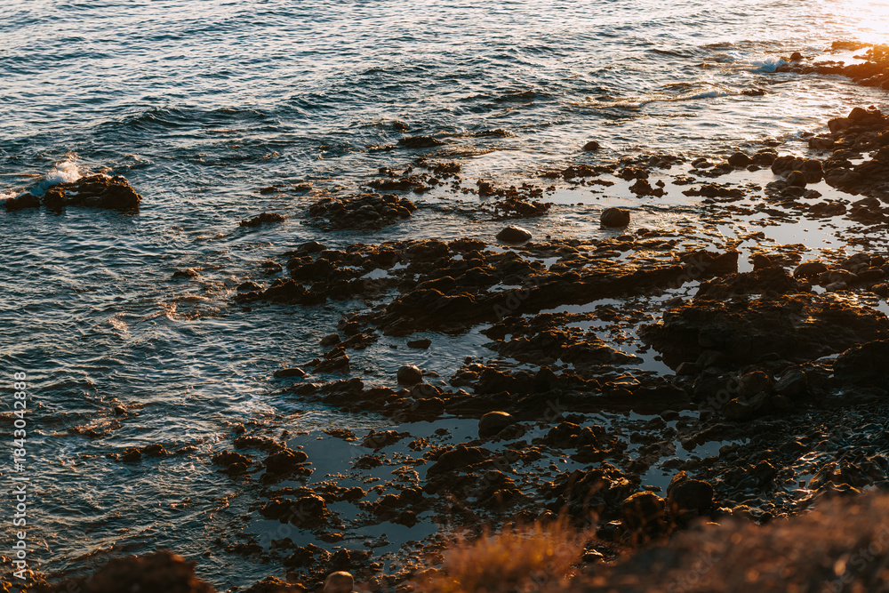 Obraz premium Romantic Ocean View on Fuerteventura Island, Minimalist Seascape with Sunlight Reflections, Winter Vacation in Europe, Peaceful Coastal Landscape