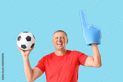 Male sports fan with soccer...