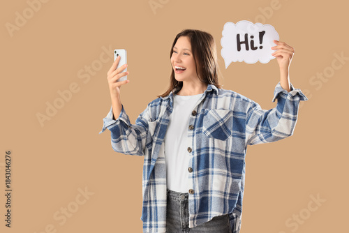 Young woman holding speech ...