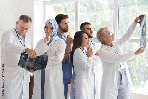 Team of doctors studying MR...
