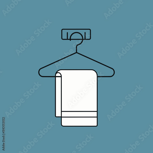 A white towel hangs on a black clothes hanger attached to a rack.