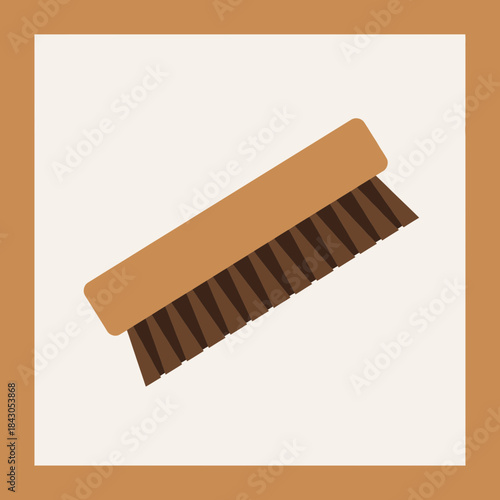 A brown brush with dark brown bristles is shown at an angle.