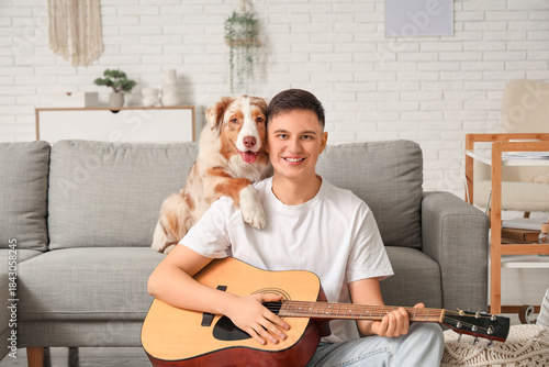 Young man with guitar and c...