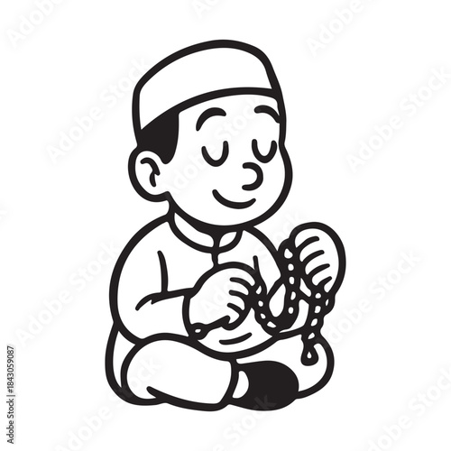 Little boy wearing kufi cap holding prayer beads in quiet contemplation
