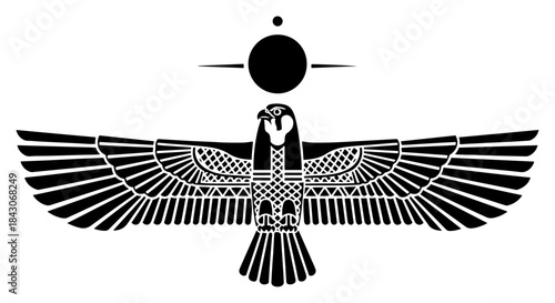 Ancient Egyptian falcon god Horus with spread wings and sun disk symbol