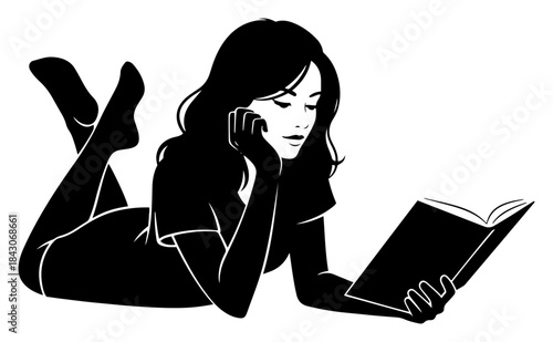 Silhouette of a relaxed woman lying on the floor reading a book