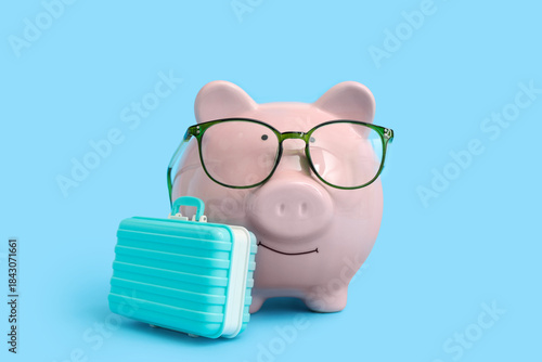Piggy bank in eyeglasses wi...