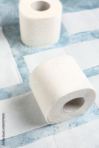 Rolls of toilet paper on bl...