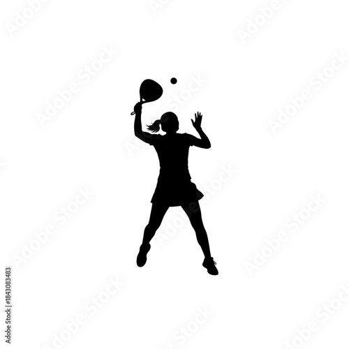 Silhouette of a female padel player hitting a ball with a racket during a game.