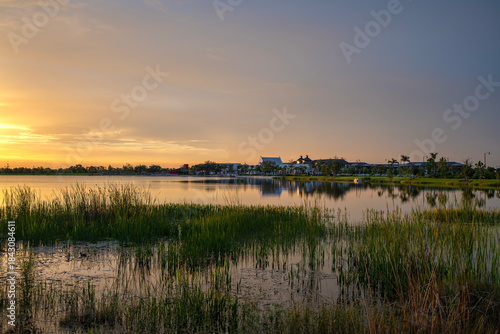 Evening landscape over lake water in southern tropical wetlands. Amazing Florida nature at sunset