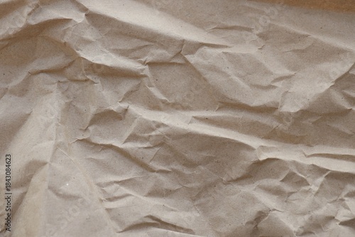 Brown crumpled recycled paper texture background. Kraft Paper
