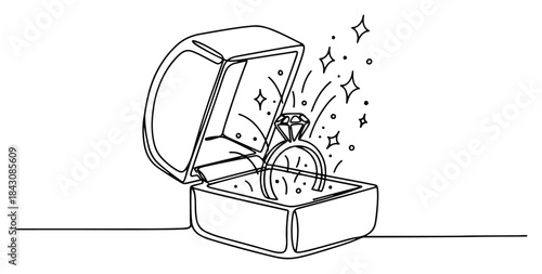 Open jewelry box with a sparkling diamond ring inside