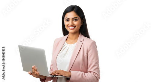 Young Indian woman in a pink suit holding a laptop with a smile on a black background computer isolated on a transparent background