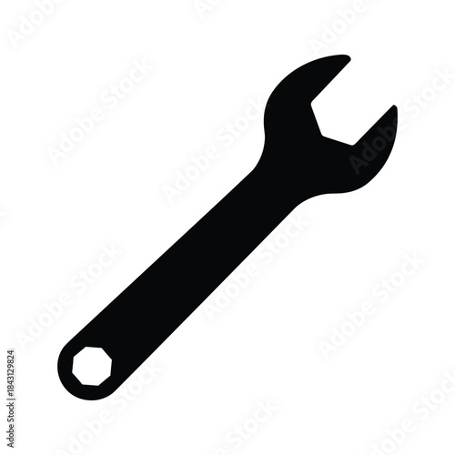 Black silhouette of a wrench isolated on