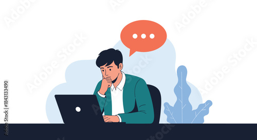 Thoughtful businessman sitting at his desk with a laptop, contemplating a problem or thinking about a response in a chat.