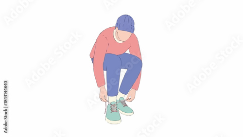 Young man tying shoelaces on his sneakers.