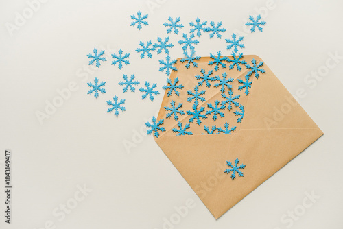 christmas tree made of paper. An envelope with snowflakes. Snowflakes in an envelope. Snowflakes flying out of the envelope.