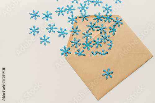 christmas tree made of paper. An envelope with snowflakes. Snowflakes in an envelope. Snowflakes flying out of the envelope.