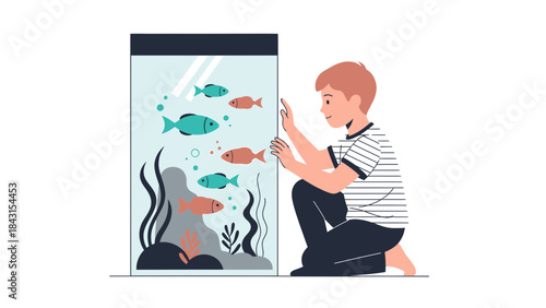 A young boy observes fish swimming inside an aquarium tank, smiling with curiosity and joy