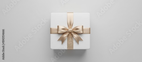 ミニマルデザインのサテンリボン付きギフトボックスを上から見た構図
