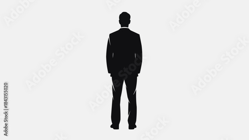 Silhouette of a man in a suit standing facing away.