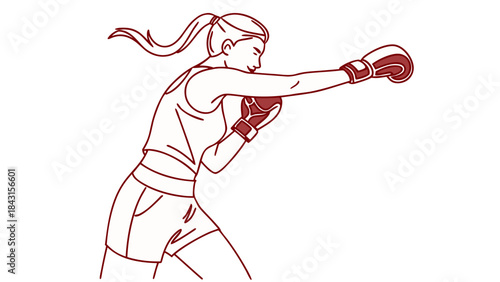 Determined woman practicing boxing, striking with focus and power