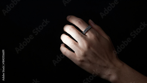 Elegantly displaying a ring dark background jewelry photography minimalist environment artistic viewpoint