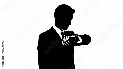 Silhouette of a businessman checking his watch.