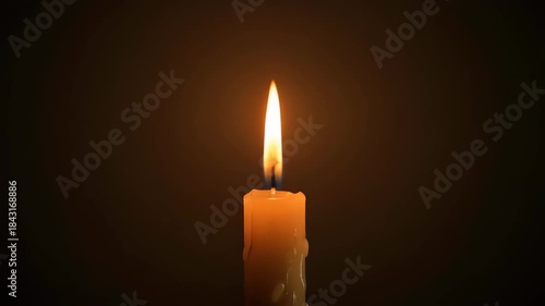 Single burning candle illuminating a dark room with a warm glow creating a peaceful and contemplative atmosphere. 4k Christmas Footage Video