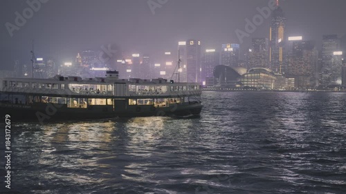 Night View of Victoria Harbor from ferry boat, Central District, 4k slow motion footage.