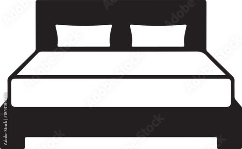 Black and white bed with two pillows and a headboard