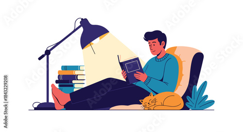 A young man relaxes comfortably at home, engrossed in a book under a warm lamp, with a stack of books and a sleeping cat nearby.