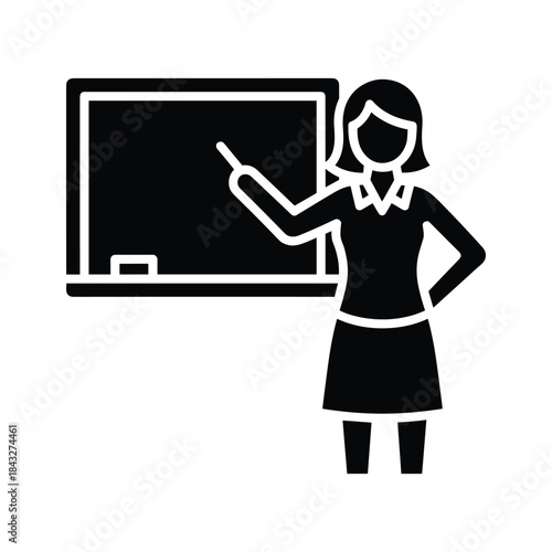 Woman teacher standing beside blackboard