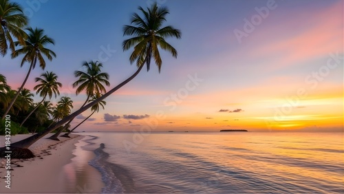 Fototapeta Naklejka Na Ścianę i Meble -  Serene tropical beach scene with leaning palm trees against a vibrant orange and purple sunset sky over calm ocean