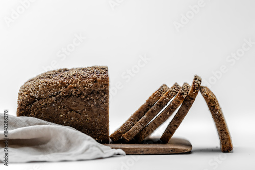 dark German bread in slices with blur