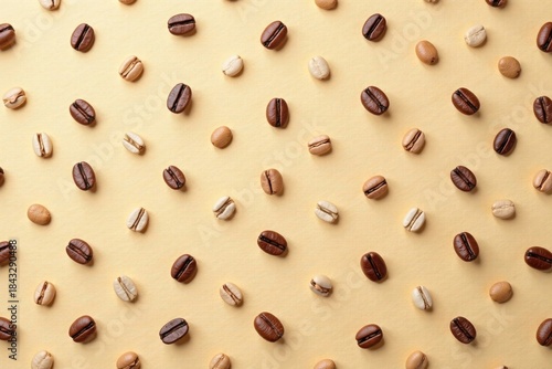 A Pattern of Roasted Coffee Beans in Shades of Brown and Beige on a Pale Yellow Background